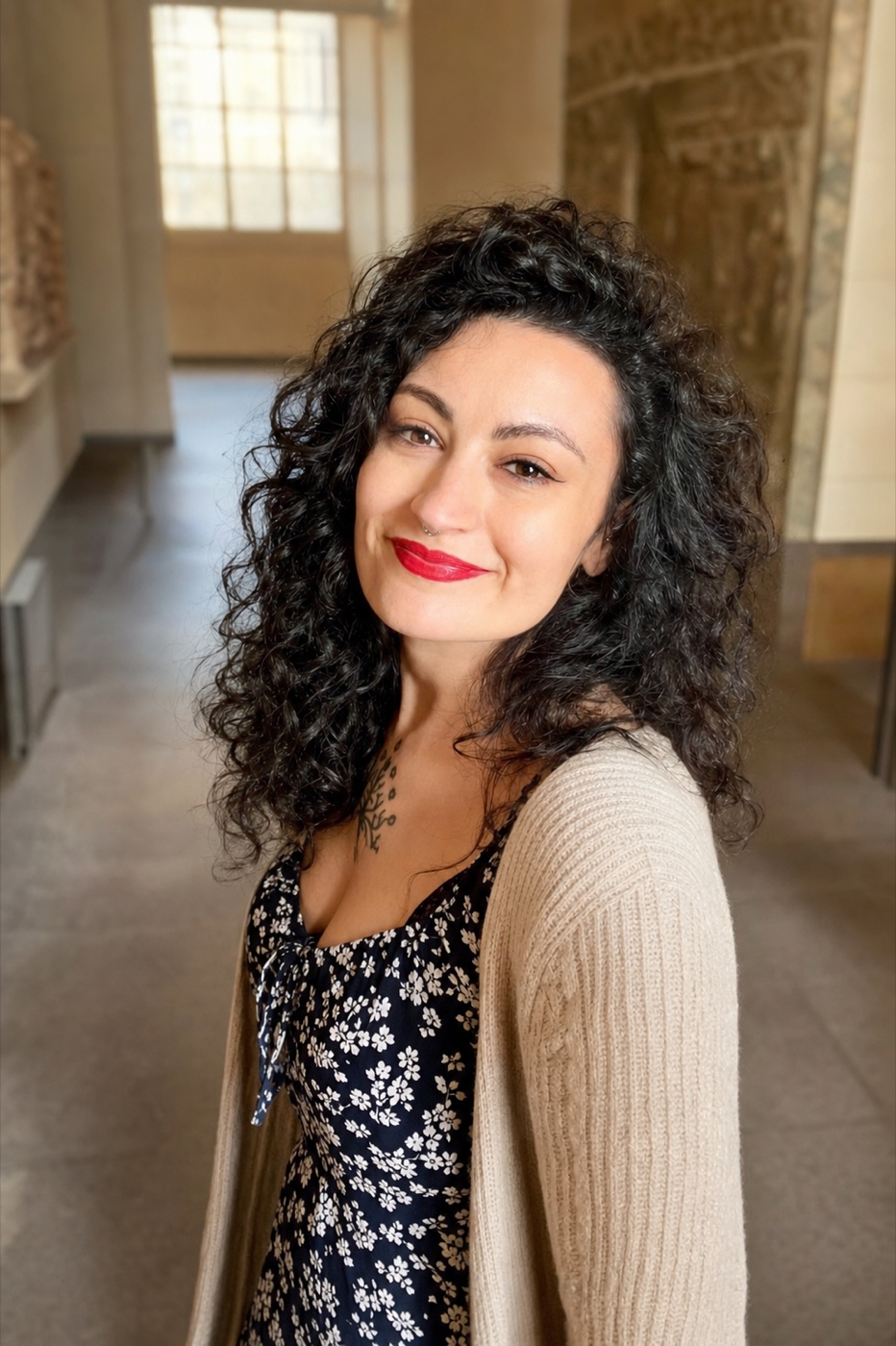 Aletia Mai smiling in a museum gallery